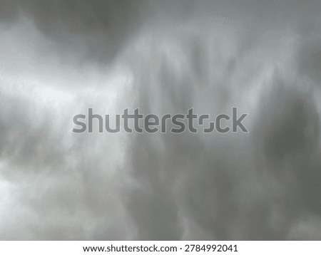 Intense grey cloud formations covering the sky in a dramatic atmospheric storm weather setting