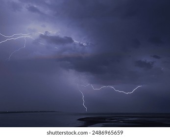 Intense lightning bolts and thunderstorm over North Atlantic ocean. - Powered by Shutterstock