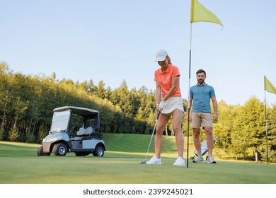 Intense Moment: Woman Concentrating on Golf Swing - Powered by Shutterstock