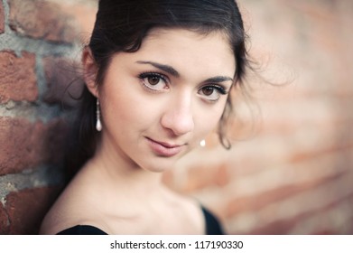 Intense Portrait Of Beautiful Girl Outdoors. Shallow Depth Of Field.