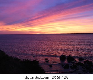 Intense Sunset With Afterglow From Cliffs On Martha's Vineyard In Fall 