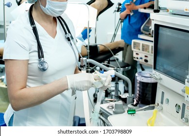 An Intensive Care Physician Prepares Equipment For Artificial Ventilation Of The Lungs For Intubation In A Critical Patient With Coronavirus. COVID-19 Epidemic Affecting The Respiratory System.