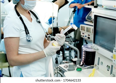 An Intensive Care Physician Prepares Equipment For Artificial Ventilation Of The Lungs For Intubation In A Critical Patient With Coronavirus. COVID-19 Epidemic Affecting The Respiratory System.