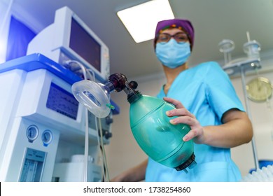 An Intensive Care Physician Prepares Equipment For Artificial Ventilation Of The Lungs For Intubation In A Critical Patient With Coronavirus. COVID-19 Epidemic Affecting The Respiratory System.