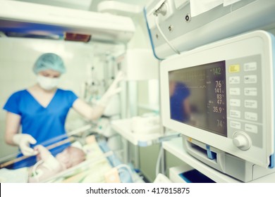 Intensive Care Unit Female Doctor With Baby Infant