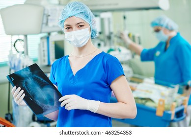 Intensive Care Unit Female Doctor With X-ray Image