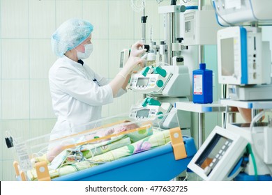 Intensive Care Unit Female Doctor With Baby Infant