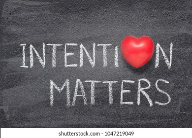 intention matters phrase handwritten on chalkboard with red heart symbol instead of O - Shutterstock ID 1047219049