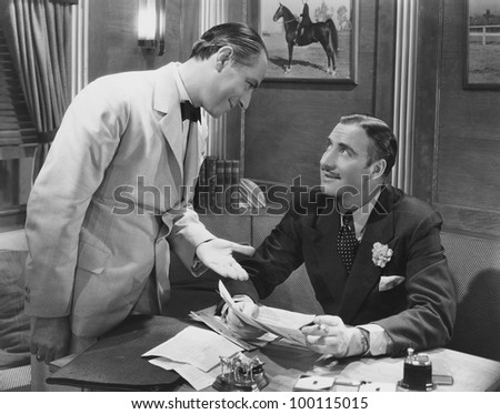 Interaction between two businessmen