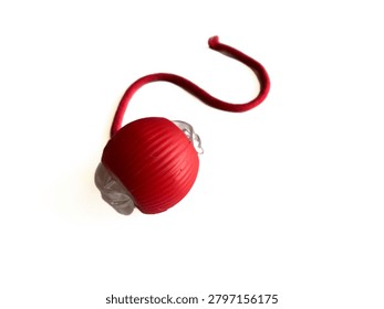 Interactive cat toy tower with rolling balls and a spring mouse, isolated on white background. Plastic roller track toy for kitten entertainment, pet shop product, and veterinary commercial mockup.