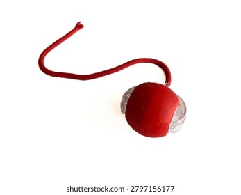 Interactive cat toy tower with rolling balls and a spring mouse, isolated on white background. Plastic roller track toy for kitten entertainment, pet shop product, and veterinary commercial mockup.