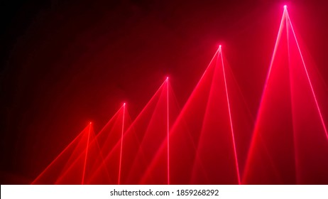 Interactive exposition in science museum or exhibition: bright laser show installation with red color rays or beams in dark room. Performance, technology, visuals, digital, contemporary art concept - Shutterstock ID 1859268292