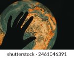 Interactive Geography.Exploring the World: Hand Spins the Glowing Globe and Searches for Country Names.
