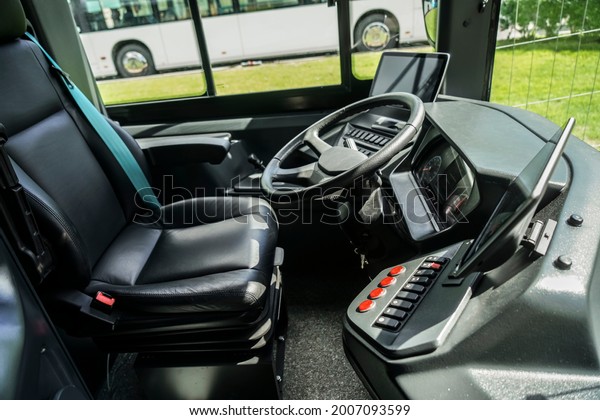 Intercity bus dashboard equipped with a video\
surveillance system monitor. steering wheel and dashboard panel of\
electric bus