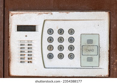 Intercom code lock on the front door. Background with selective focus and copy space for text