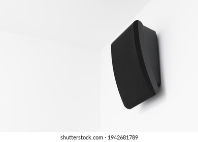 intercom speaker mounted on white wall in a hotel room - Powered by Shutterstock