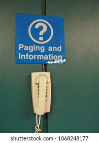 Intercom unit mounted on the wall to be used for paging and information at a public transportation terminal