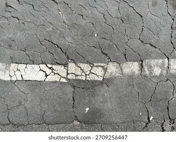Interconnected cracks, highlighting the need for road maintenance.