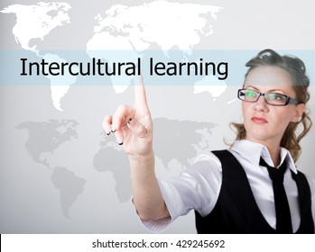 Intercultural Learning Written In Search Bar On Virtual Screen. Internet Technologies In Business And Home. Woman In Business Suit And Tie, Presses A Finger On A Virtual Screen