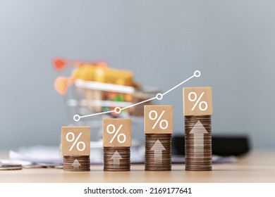 Interest on stack of coins stacked on table with percentage icon on wooden wooden block with white illustration showing interest rate increase financial concept. - Shutterstock ID 2169177641