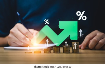Interest rate and dividend concept, Businessman is calculating income and return on investment in percentage. income, return, retirement, compensation fund, investment, dividend tax, stock market - Shutterstock ID 2237392519