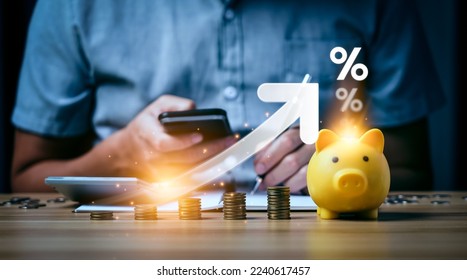 Interest rate and dividend concept, Businessman is calculating income and return on investment in percentage. income, return, retirement, compensation fund, investment, dividend tax, stock market - Shutterstock ID 2240617457