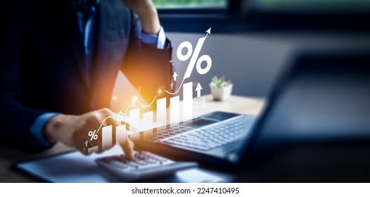 Interest rate and dividend concept, Businessman is calculating income and return on investment in percentage. income, return, retirement, compensation fund, investment, dividend tax, stock market - Shutterstock ID 2247410495