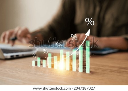 Interest rate and dividend concept,  Businesswoman calculates investment returns with percentage symbol and up arrow, return on stocks and mutual funds, long term investment for retirement.