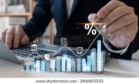 Interest rate and dividend concept.Businessman stacking coins and calculating with percentage for interest rating. Investor, trader, investment, fund and stock market.