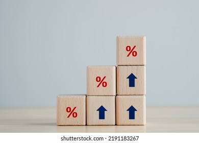 Interest rate finance and mortgage rates concept.  Wooden blocks with blue arrow up and red percentage sign, financial growth, interest rate increase, inflation, sale price and tax rise concept. - Shutterstock ID 2191183267