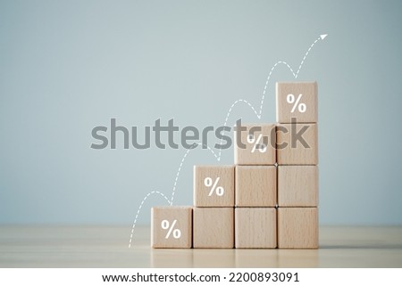 Interest rate finance and mortgage rates. percentage sign on  ladder of wooden block and growth step of arrow up. financial growth, interest rate increase, inflation, sale price and tax rise concept.