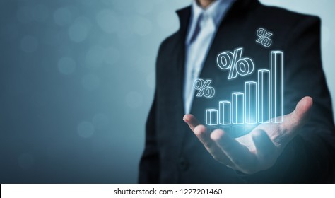 Interest Rate Financial And Mortgage Rates Concept. Businessman Hand Show Icon Percent 3d Sign With Graph Indicator