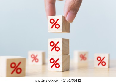 Interest Rate Financial And Mortgage Rates Concept. Hand Putting Wood Cube Block Increasing On Top With Icon Percentage Symbol Upward Direction