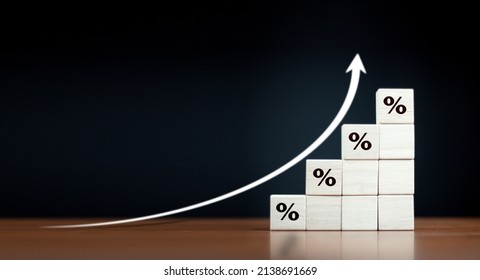 Interest Rate Financial And Mortgage Rates Concept. Wooden Blocks With Icon Percentage Symbol And Arrow Pointing Up. The Economy Is Improving.