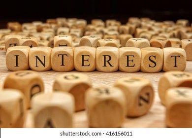 Interest word written on wood block