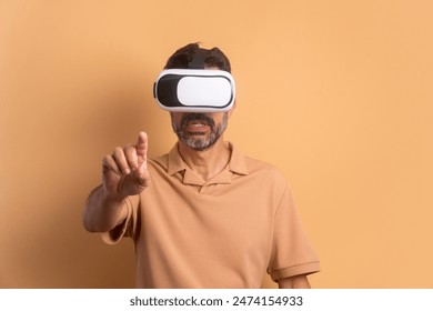 interested brazilian man Using VR headset and gesturing in beige colors. virtual reality, technology simulation concept. - Powered by Shutterstock