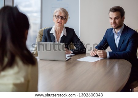 Interested hr managers focused on listening applicant at job interview, recruiters employers talking to seeker asking questions meeting vacancy candidate, staffing, hiring and recruitment concept