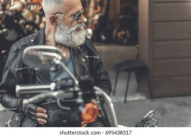 Interested Old Man On Motorcycle