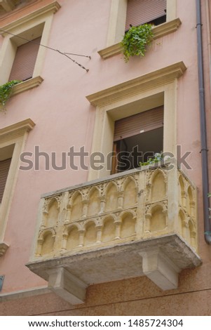 Interesting balcony, arched modeling, Verona, Italy