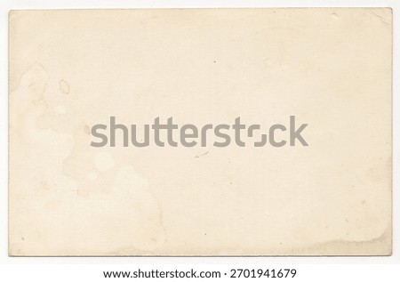 Interesting texture of old paper, soiled and damaged, as well as darkened by time and use, on a white background. Unique vintage texture of old paper which is approximately 60-70 years old.