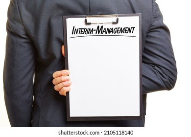 Interim Management Concept With Manager Holding Clipboard