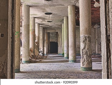 interior of abandoned building with rubble and debris - destroyed room with columns cf an old building in ruins