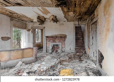 Interior Of Abandoned House Falling Apart With Debris Covering Floor