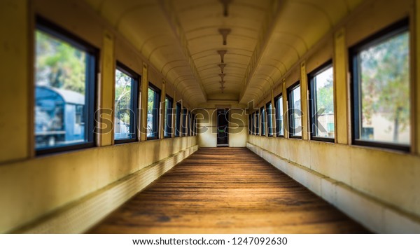 The interior\
of an abandoned, seatless rail car\

