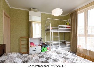 Interior Of An Adult Bedroom, In The Room There Is A Children's Bunk Bed