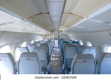 Interior of an airplane with many empty seats