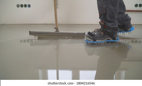 Interior of apartment under construction. Mirror smooth surface of the floor. Floor covering with self leveling cement mortar. Roller application - Powered by Shutterstock