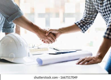 Interior Architect Hand Shaking With Contract Engineering.
