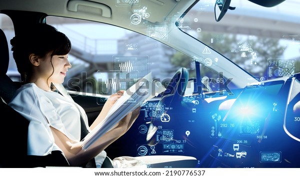 Interior of autonomous car.\
Driverless vehicle. Driving assist system. HUD (Heads up\
display).