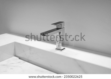 Interior bathroom, Faucet and water drop close up. Bathroom interior with sink and water tap. Flow water in bathroom with sink.